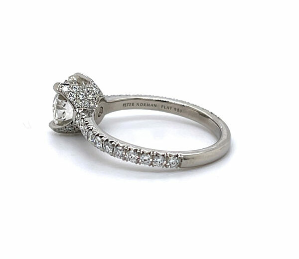 Round diamond engagement ring with pave cup in platinum