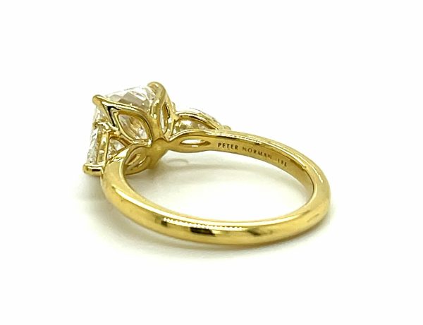 Cushion and Pear Three-Stone Ring in Yellow Gold Custom Engagement Rings 4