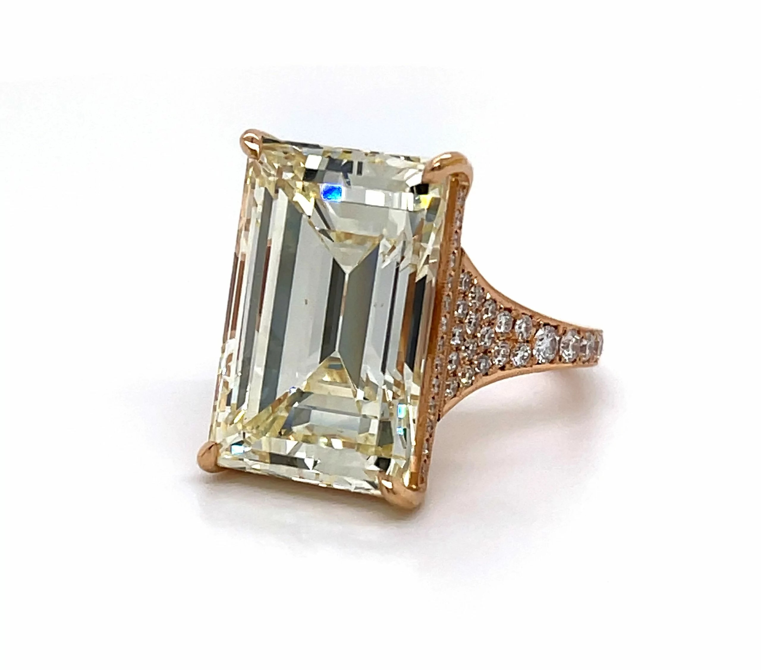 Statement Emerald Cut Engagement Ring With A Tapered Pave Band