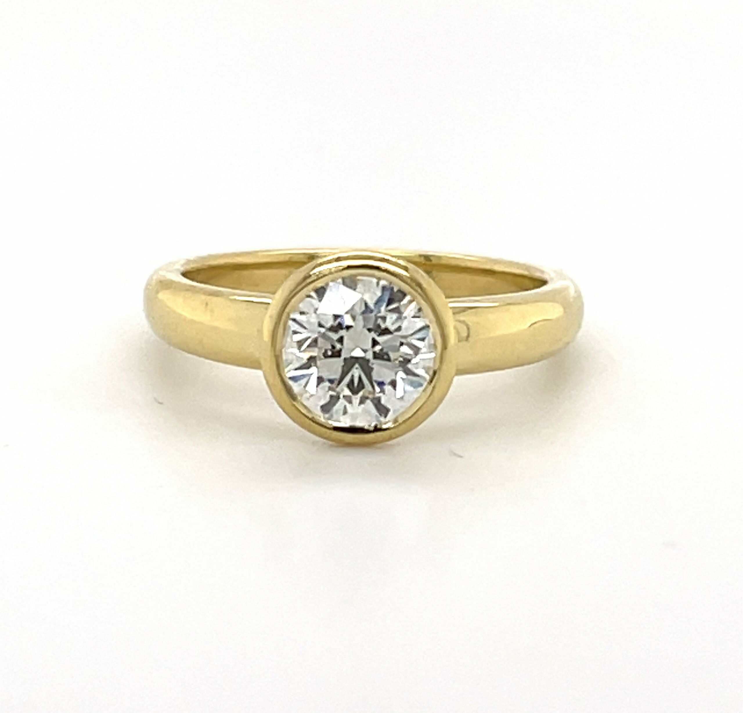 Yellow Gold Ring with a Bezel Set Round Diamond