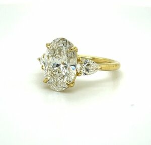 Oval Engagement Ring with Pear Side Stones Engagement Rings