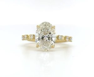 Oval Engagement Ring with a Scattered Diamond Band Engagement Rings 2