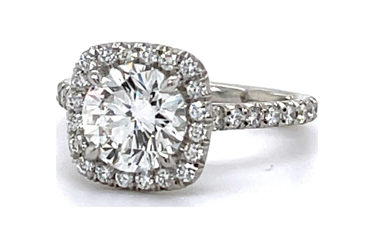 Peter Norman Round Platinum Engagement Ring with Cushion Halo