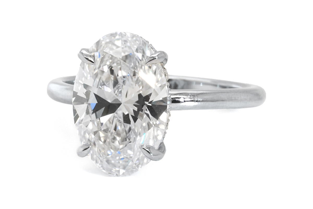 Peter Norman Oval Diamond Solitaire with Hidden Halo