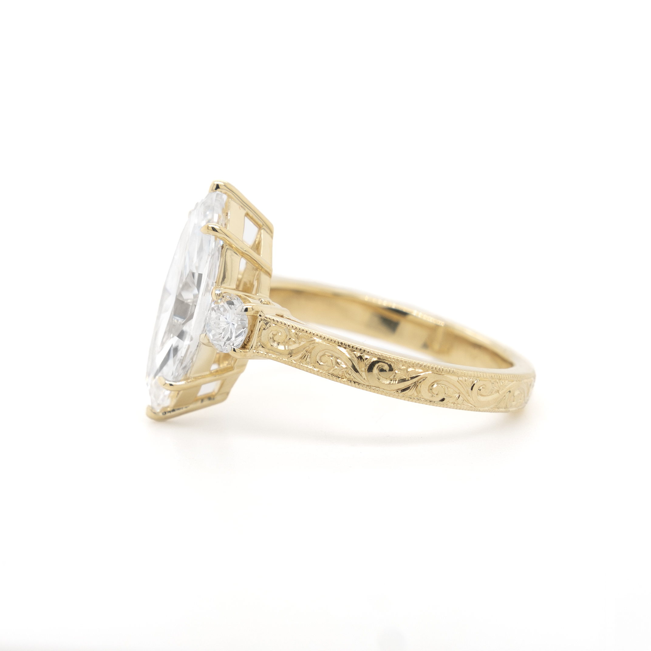 Peter Norman Jewelers custom marquise-cut engagement ring, side view