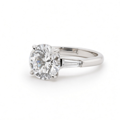 Round Brilliant Diamond Ring in Platinum with Tapered Baguettes and Floral Prongs Custom Engagement Rings